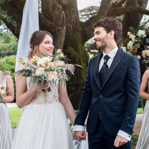 Bride and
Groom holding hands.