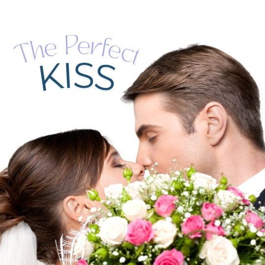 Bride and Groom kissing
                      behind a bouquet of pink and white roses